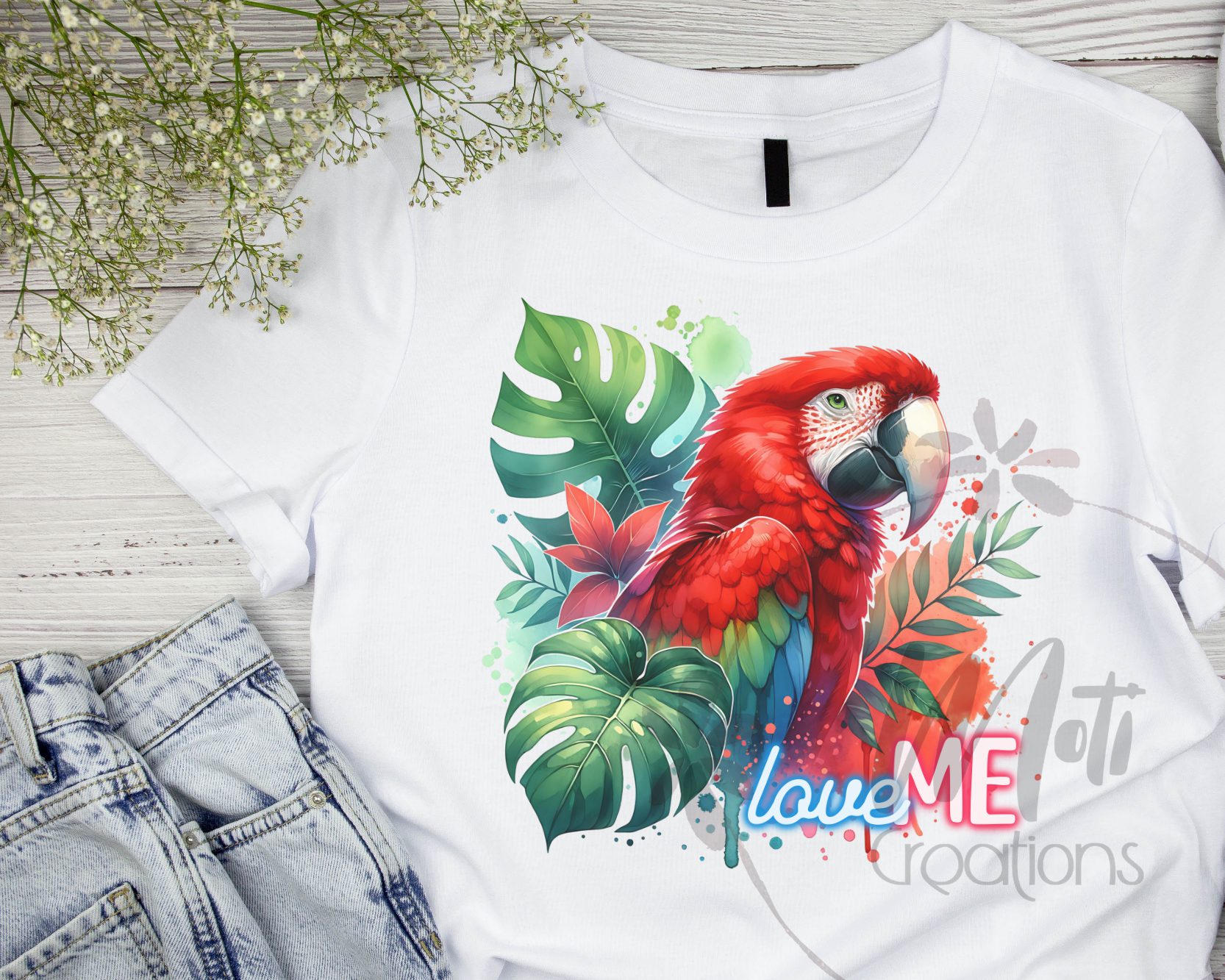 a white shirt with a red parrot on it