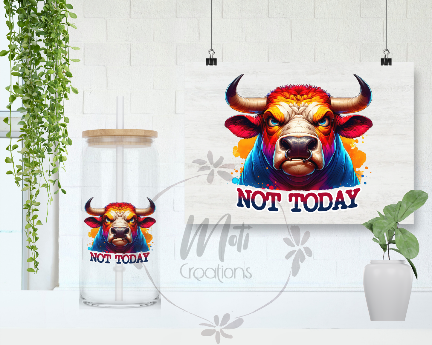 a picture of a bull on a wall next to a plant