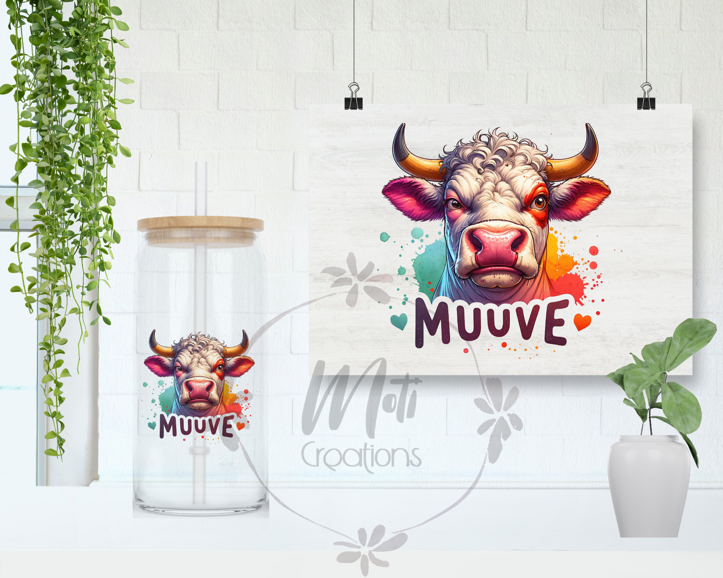 a picture of a cow on a wall next to a plant