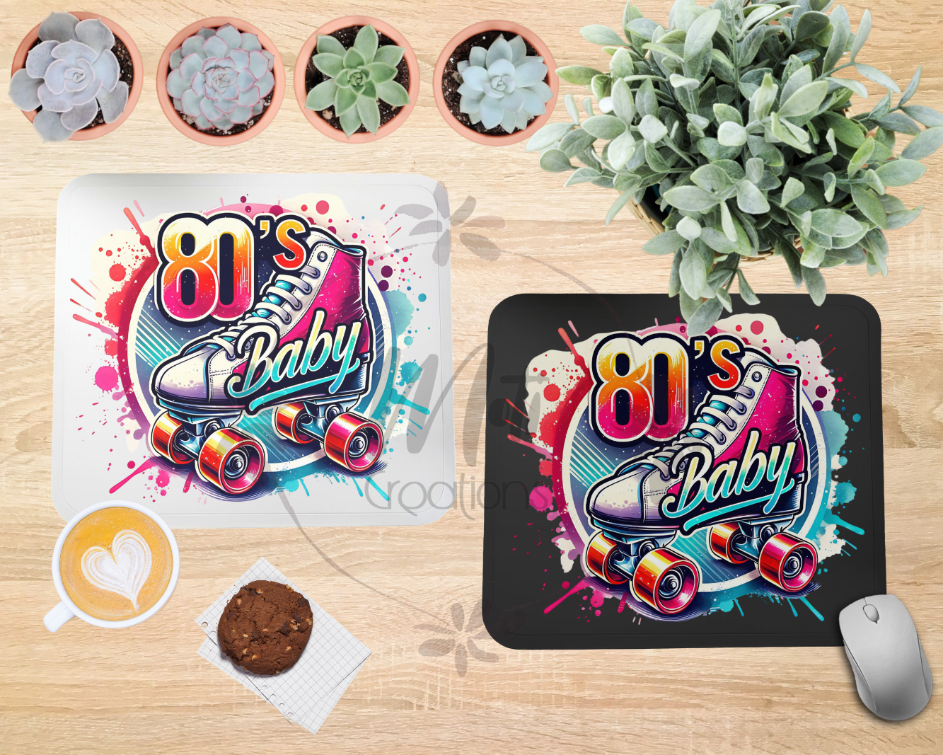 a pair of skateboard mousepads sitting on top of a wooden table